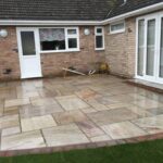 Raveena Indian sandstone patio area with burnt amber edging - Diss, Suffolk
