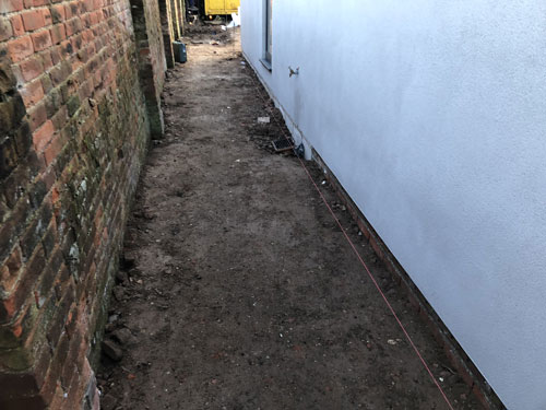 Preparing area for 600 x 600 Grey domestic slabs - Aylsham